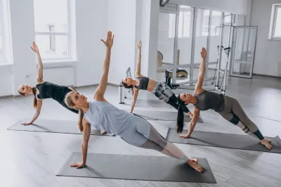Yoga group classes inside the gym, Freepik